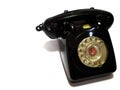 A vintage and antique telephone with white background.