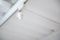 Closeup of adjustable downlight installed on white ceiling Royalty Free Stock Photo
