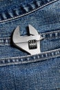 Closeup of an adjustable wrench in jean pocket Royalty Free Stock Photo