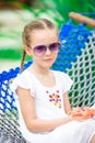 Closeup adorable little girl relaxing in hammock on tropical vacation Royalty Free Stock Photo