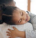 Closeup adorable little girl smiling and hugging her single father inside at home. Cute mixed race child enjoying Royalty Free Stock Photo