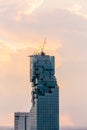 Closeup Aerial view of Bangkok modern office buildings, condominium in Bangkok city downtown at the dusk. With golden sky. Royalty Free Stock Photo