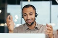 Closeup African American businessman with a headset talking remotely on video call, office worker looking into laptop Royalty Free Stock Photo