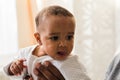 Closeup of African American curious baby boy looking away Royalty Free Stock Photo