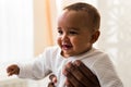 Closeup of African American curious baby boy looking away Royalty Free Stock Photo