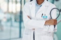 Closeup african american woman doctor standing with a stethoscope in the hospital. I need to listen to your heart beat Royalty Free Stock Photo