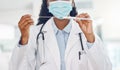 Closeup african american woman doctor wearing a mask and holding a swab test in the hospital. Testing for the corona