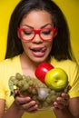 Closeup African AMerican woman with fruits. Royalty Free Stock Photo