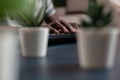 Closeup of african american young entrepreneur hand typing communication project