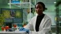 Closeup of african biologist woman looking into camera Royalty Free Stock Photo