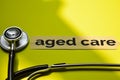 Closeup aged care with stethoscope concept inspiration on yellow background