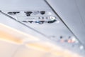 Closeup airplane Console panel; lamp, light, need help button, air condition, sefty belt and no smoking lighting sign Royalty Free Stock Photo