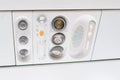 Closeup airplane Console panel; lamp, light, need help button, air condition, sefty belt and no smoking lighting sign Royalty Free Stock Photo