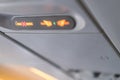 Closeup airplane Console panel; lamp, light, need help button, air condition, sefty belt and no smoking lighting sign Royalty Free Stock Photo