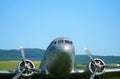 Closeup of an airplane taking off a field during daylight Royalty Free Stock Photo