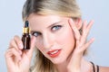 Closeup alluring portrait of woman applying CBD oil as skincare concept.