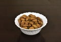 Closeup of almonds in a white bowl