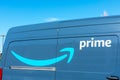 Closeup. Amazon Prime logo on Amazon.com branded minivan. Amazon Prime is a paid subscription service