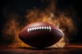 Closeup an American football ball shrouded in dramatic smoke Royalty Free Stock Photo