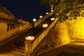 Closeup ancient architectural building with Buddhism garland flowers a night