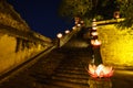 Closeup ancient architectural building with Buddhism garland flowers a night Royalty Free Stock Photo