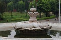 Closeup of an ancient inactive fountain in the garden of Taj palace