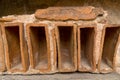 Closeup ancient Roman clay brick depressions cement Royalty Free Stock Photo