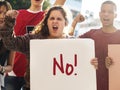 Closeup of angry teen girl protesting demonstration holding posters antiwar justice peace concept Royalty Free Stock Photo