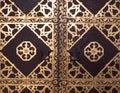 Closeup of antique church door with golden ornate Royalty Free Stock Photo