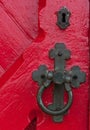 Closeup of an antique door handle and keyhole on a wooden red do Royalty Free Stock Photo
