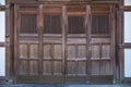 closeup antique folding door asian style wooden door with grill for temple shrine entrance