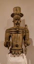 Closeup of an antique idol carved from wood in a museum