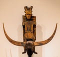 Closeup of an antique idol carved from wood in a museum