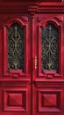 Ornate red double door of historic building in European city Odessa of Ukraine Royalty Free Stock Photo