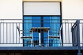 Apartment terrace with a small table and two chairs Royalty Free Stock Photo