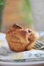 A Closeup of an Apple Muffin on a Napkin with a Fork