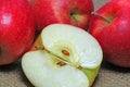 Closeup of apples on a burlap background.