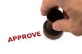 Closeup of approved on rubber stamp Royalty Free Stock Photo