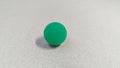 Aqua Opaque Bouncy Ball on Table