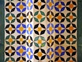 Closeup of arab tiles and stucco, islamic pattern mosaic. Palace of Alhambra in Granada, Andalusia, Spain