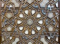 Closeup of arabesque ornaments of an old an aged decorated wooden door