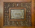 Closeup of arabesque ornaments of an old aged decorated wooden door, Cairo, Egypt