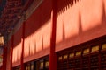 Closeup of archictural designs of red Asian-style buildings on a sunny day