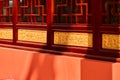 Closeup of archictural designs of red Asian-style buildings on a sunny day