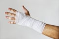 Closeup of arm wrapped with medical gauze