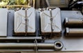 Closeup of armored military vehicle. Detail of different work tools on the side of the vehicle