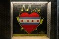 Closeup of an art mural with heart and skyline on the black wall, Chicago street