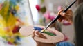 Closeup artist woman holding colour palette. Royalty Free Stock Photo