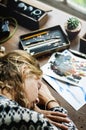 Closeup of artist woman taking a nap on work table Royalty Free Stock Photo