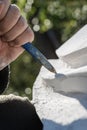 Closeup of an artist working in white stone Royalty Free Stock Photo